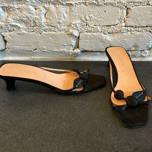 Prada, black satin floral design heels with peach leather slide.